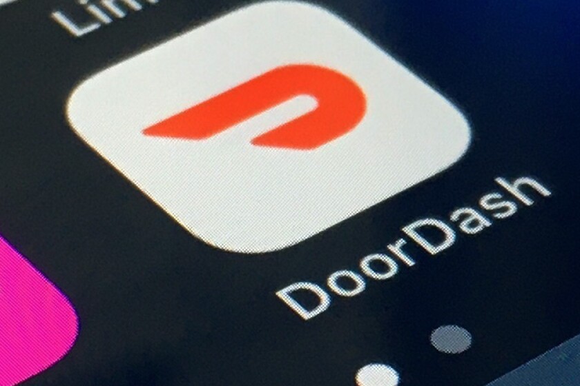 FILE - The DoorDash app is shown on a smartphone on Feb. 27, 2020, in New York. Delivery company DoorDash said Tuesday, March 15, 2022, it will refund its drivers for some U.S. gasoline purchases to help offset higher prices at the pump. (AP Photo/File)