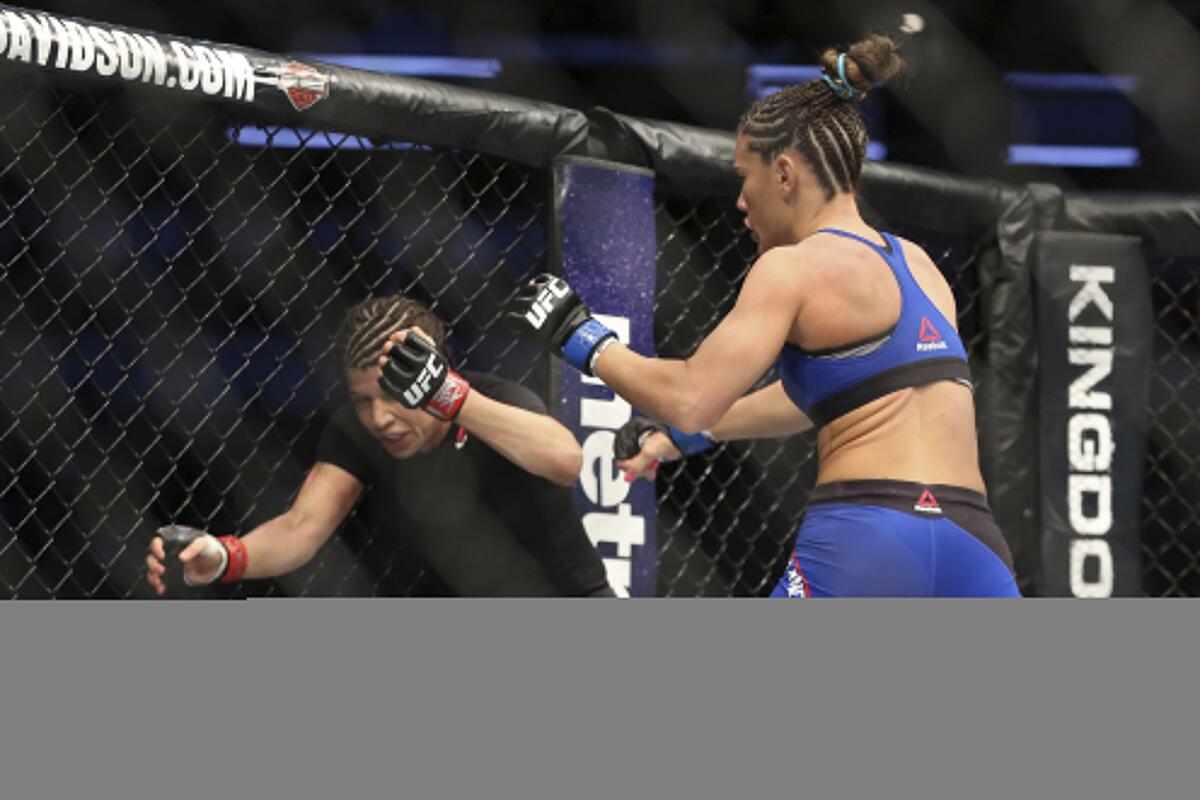 Cortney Casey right, puts Jessica Aguilar on the defensive during their bout at UFC 211.