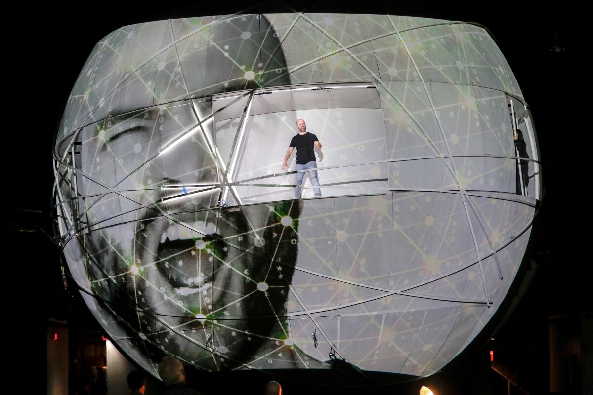 John Brancy, singing from within the giant orb during rehearsal for Meredith Monk's "Atlas." 