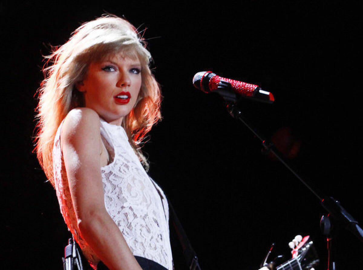 Taylor Swift performs at the 2013 CMA Music Festival in Nashville.