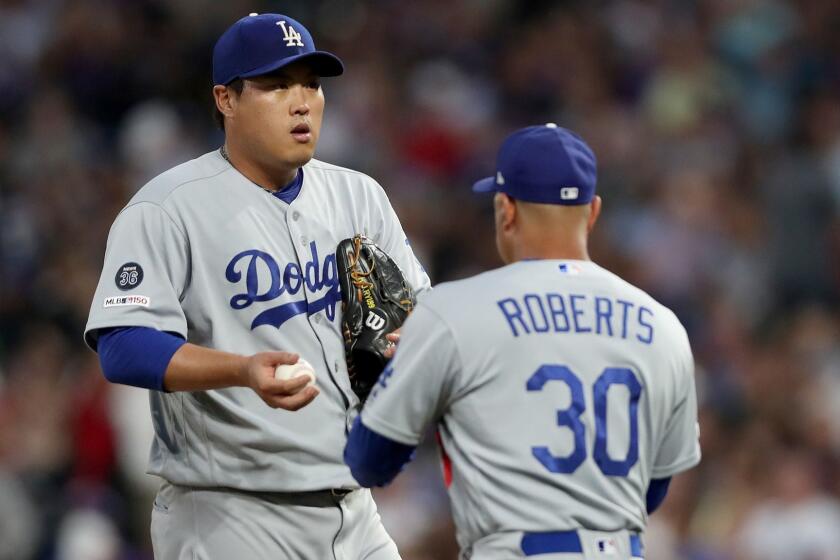 DENVER, COLORADO - JUNE 28: Starting pitcher Hyun-Jin Ryu #99 of the Los Angeles Dodgers is relieved by manager Dave Roberts #30 in the fifth inning against the Colorado Rockies at Coors Field on June 28, 2019 in Denver, Colorado. (Photo by Matthew Stockman/Getty Images) ** OUTS - ELSENT, FPG, CM - OUTS * NM, PH, VA if sourced by CT, LA or MoD **