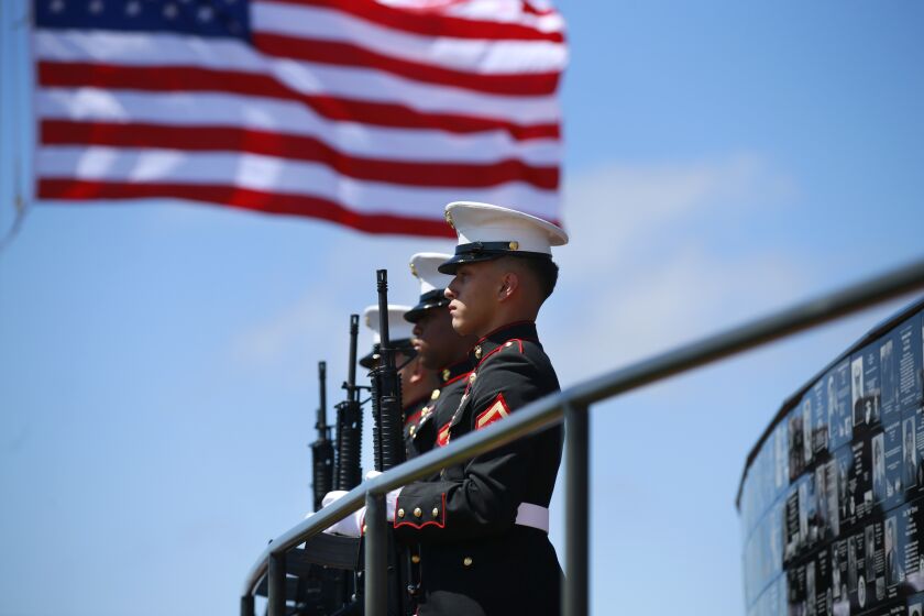 Members of the Marine Corps Recruit Depot Military Funeral Honors detail stand at attention during a Memorial Day Ceremony at the Mt. Soledad National Veterans Memorial in La Jolla on May 27, 2019.