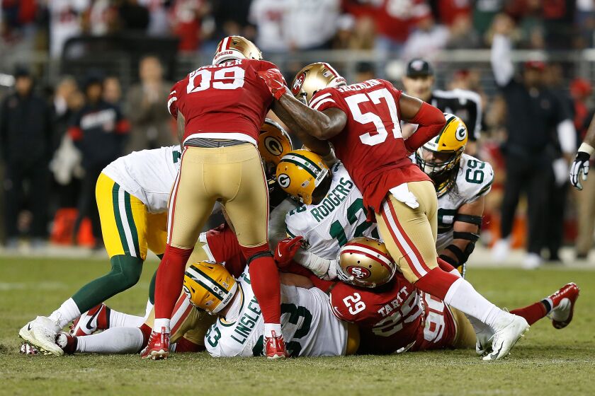SANTA CLARA, CALIFORNIA - NOVEMBER 24: Quarterback Aaron Rodgers #12 of the Green Bay Packers is sacked in the fourth quarter against the San Francisco 49ers at Levi's Stadium on November 24, 2019 in Santa Clara, California. (Photo by Lachlan Cunningham/Getty Images)
