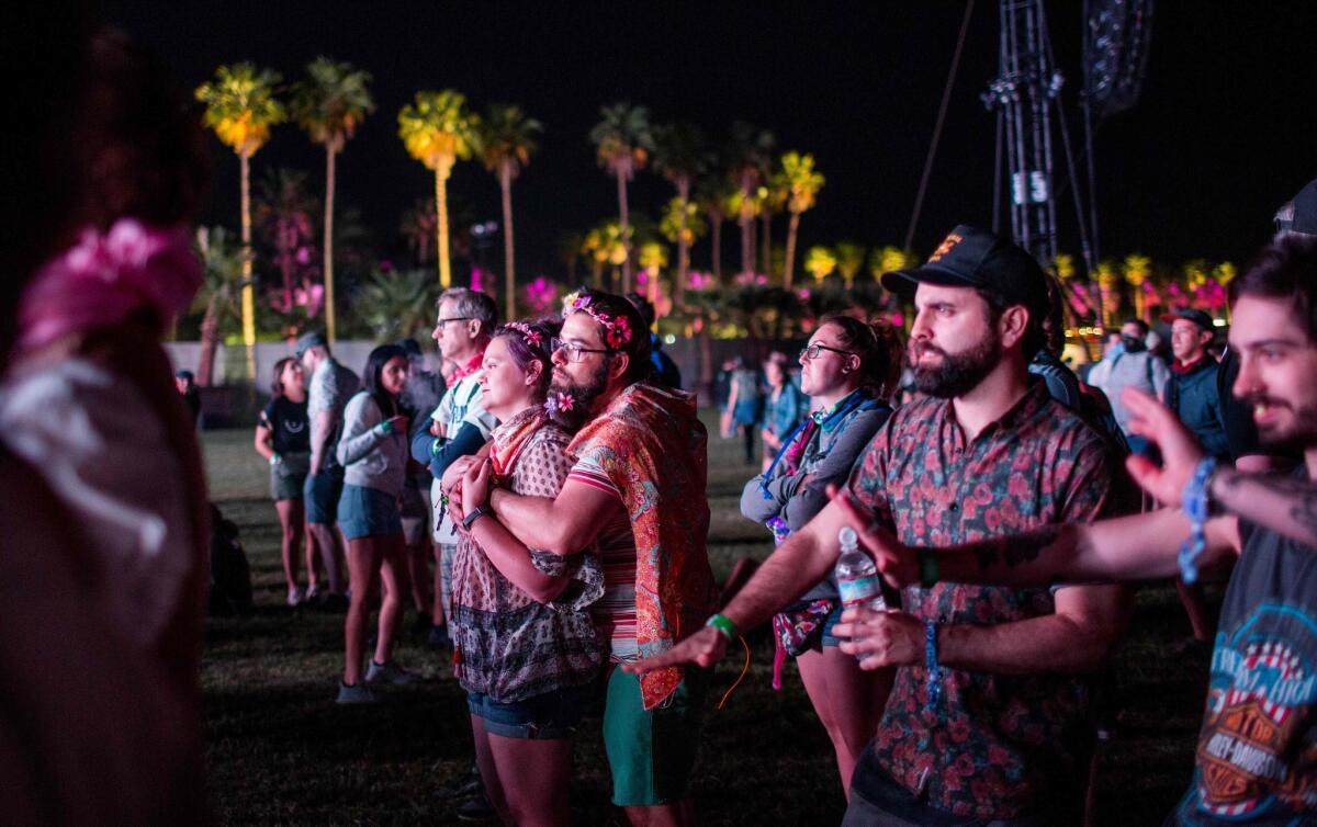 Fans watch blandly as Jean-Michel Jarre performs at the Coachella Music and Arts Festival on Friday.