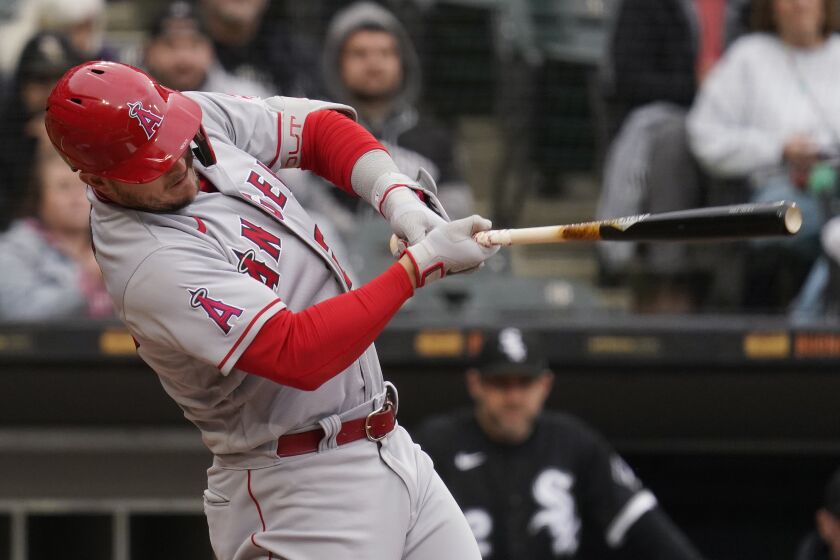 Los Angeles Angels' Mike Trout hits a solo home run during the first inning.