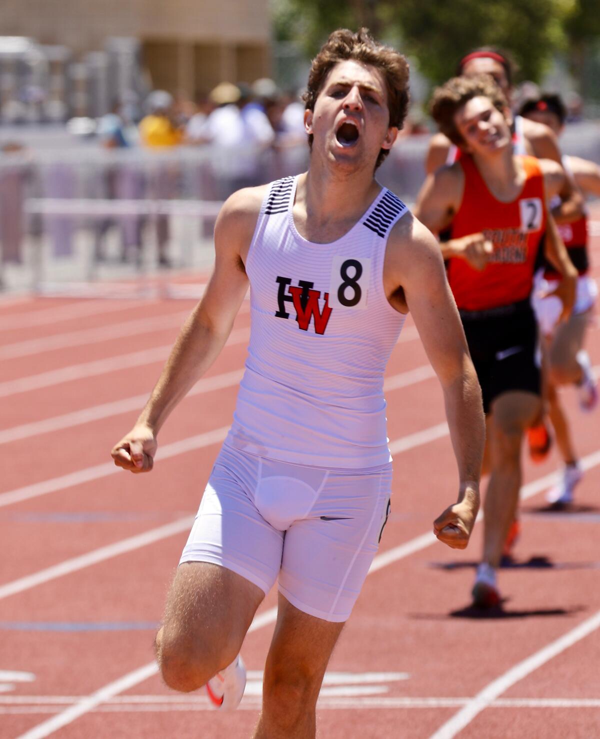 Harvard-Westlake's Isaac Dienstag reacts after winning the 800 meters.