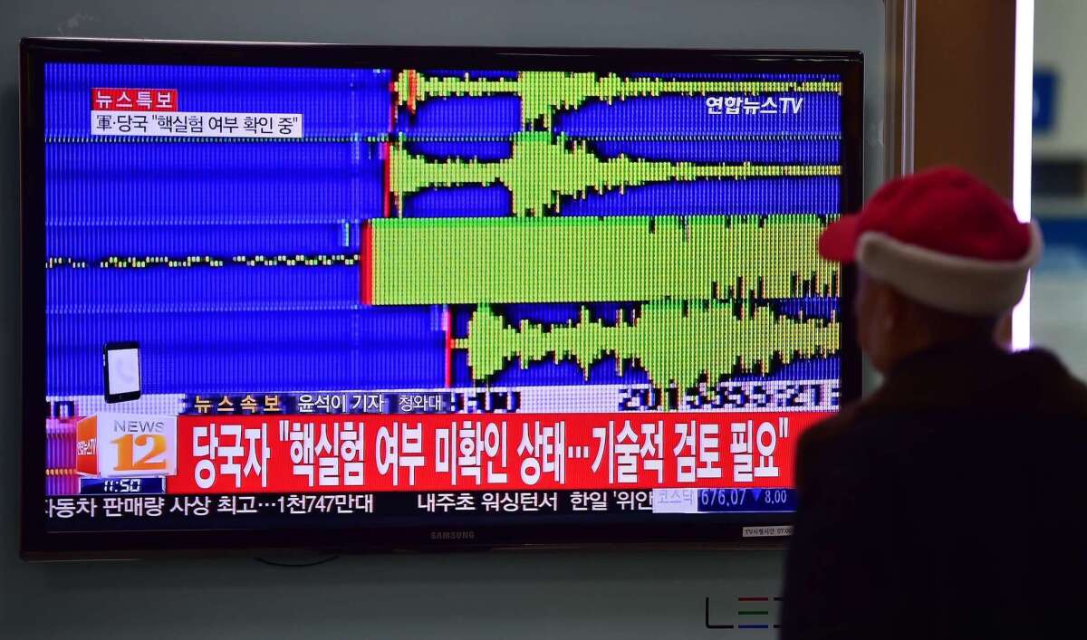 A man watches a news report at a railroad station in Seoul, South Korea, on Jan. 6, 2016, after seismologists detected a 5.1-magnitude tremor next to North Korea's main atomic test site in the northeast of the country. North Korea said it had successfully carried out its first hydrogen bomb test.