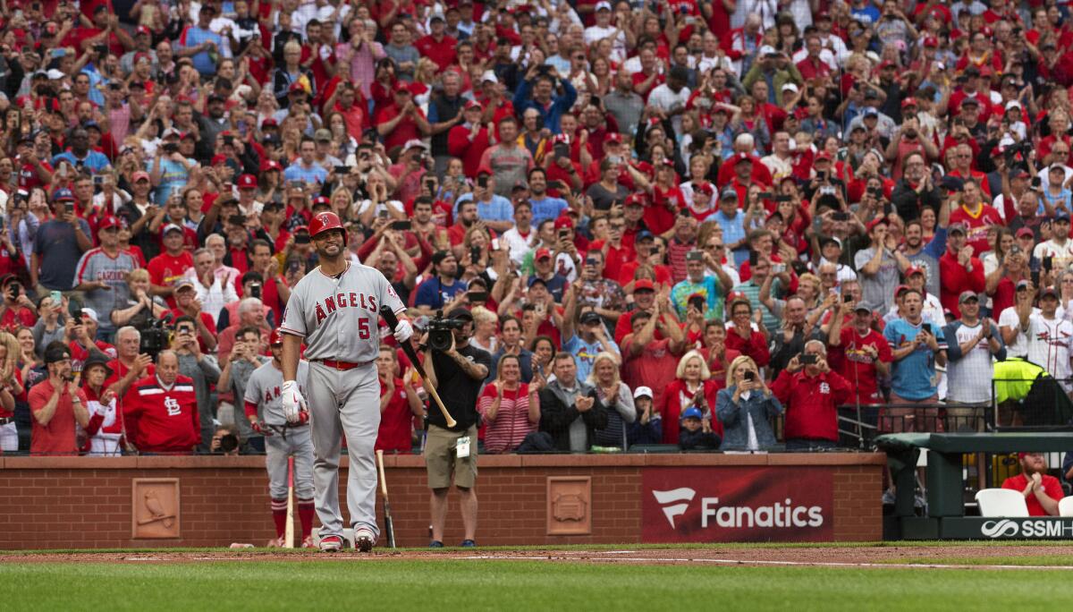 Albert Pujols is greeted with a standing ovation before his first at-bat during his first game back in St. Louis.