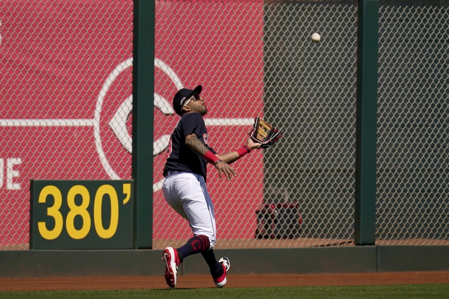 Cleveland Indians' Victor Martinez celebrates as he rounds the