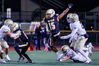 Brice Hawkins of Simi Valley goes airborne on his way to 202 yards rushing and four touchdowns.