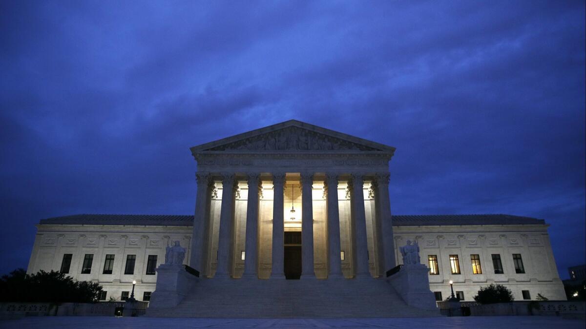 The Supreme Court building is seen at dawn on Capitol Hill in Washington on Sept. 27, 2018.