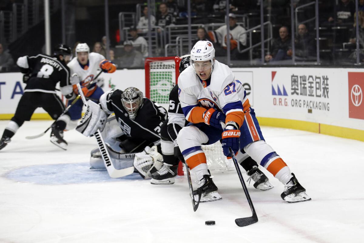 Islanders center Anders Lee (27) works with the puck down low near the Kings' crease during the first period of a game Nov. 27 at Staples Center.
