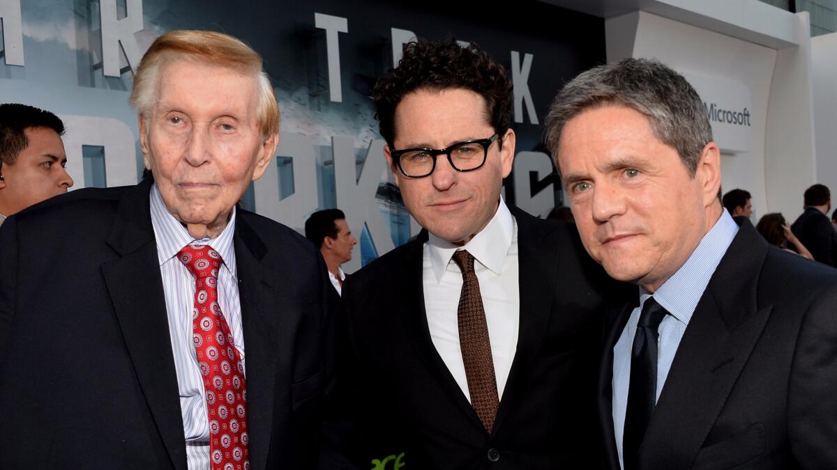 From left, Sumner Redstone, J.J. Abrams and Brad Grey arrive at the premiere of Paramount Pictures' "Star Trek Into Darkness" at Dolby Theatre on May 14, 2013.