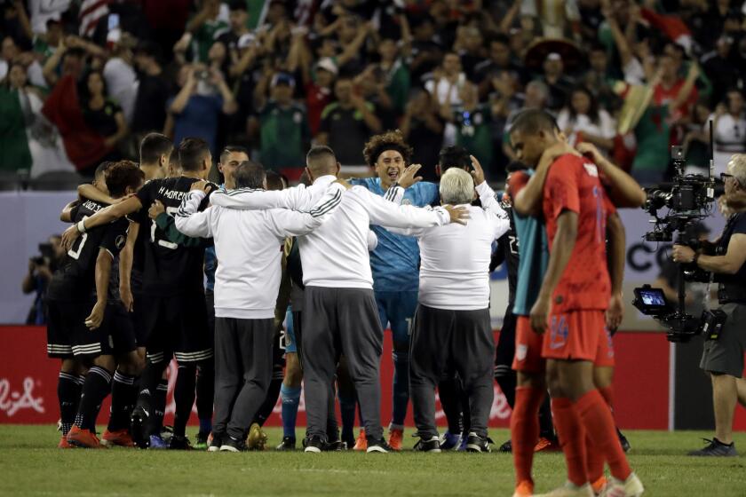 Mexico players celebrate after Mexico defeated United States 1-0 in the CONCACAF Gold Cup final soccer match at Soldier Field in Chicago, Sunday, July 7, 2019. (AP Photo/Nam Y. Huh)