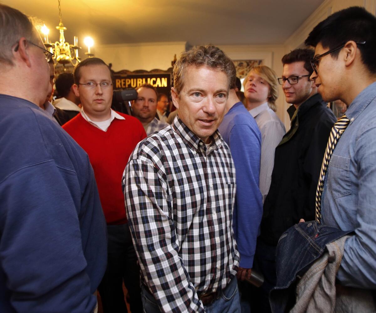 Sen. Rand Paul, R-Ky., walks through a crowd of young Republicans at the state GOP party headquarters in Concord, N.H. to rally voters on Oct. 16 ahead of the November election.