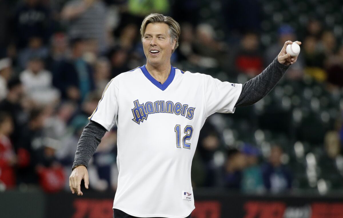 Mark Langston throws out the ceremonial first pitch before a baseball game between the Seattle Mariners and Angels in May 2017.