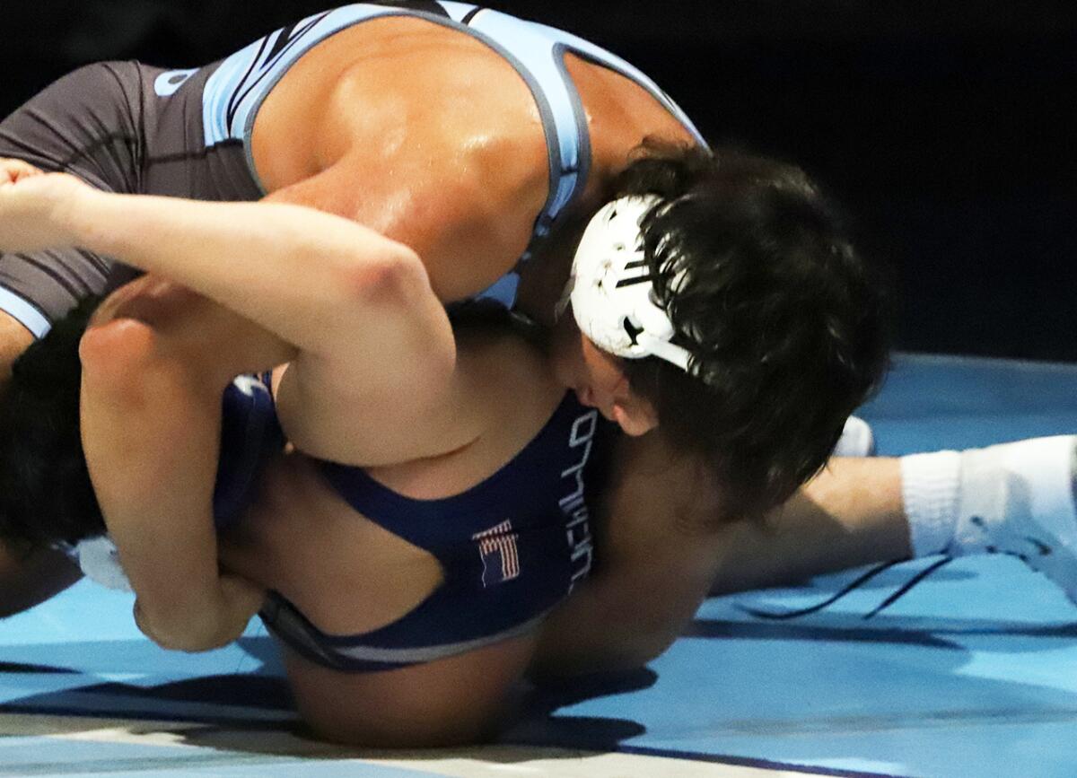 Corona del Mar's Eugenio Franco pins Newport Harbor's Christopher Cuchillo in the Battle of the Bay.