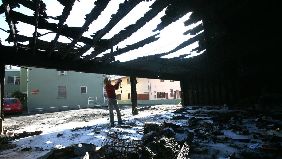 A carport is left charred from an arson fire at a West Hollywood apartment in January 2012.