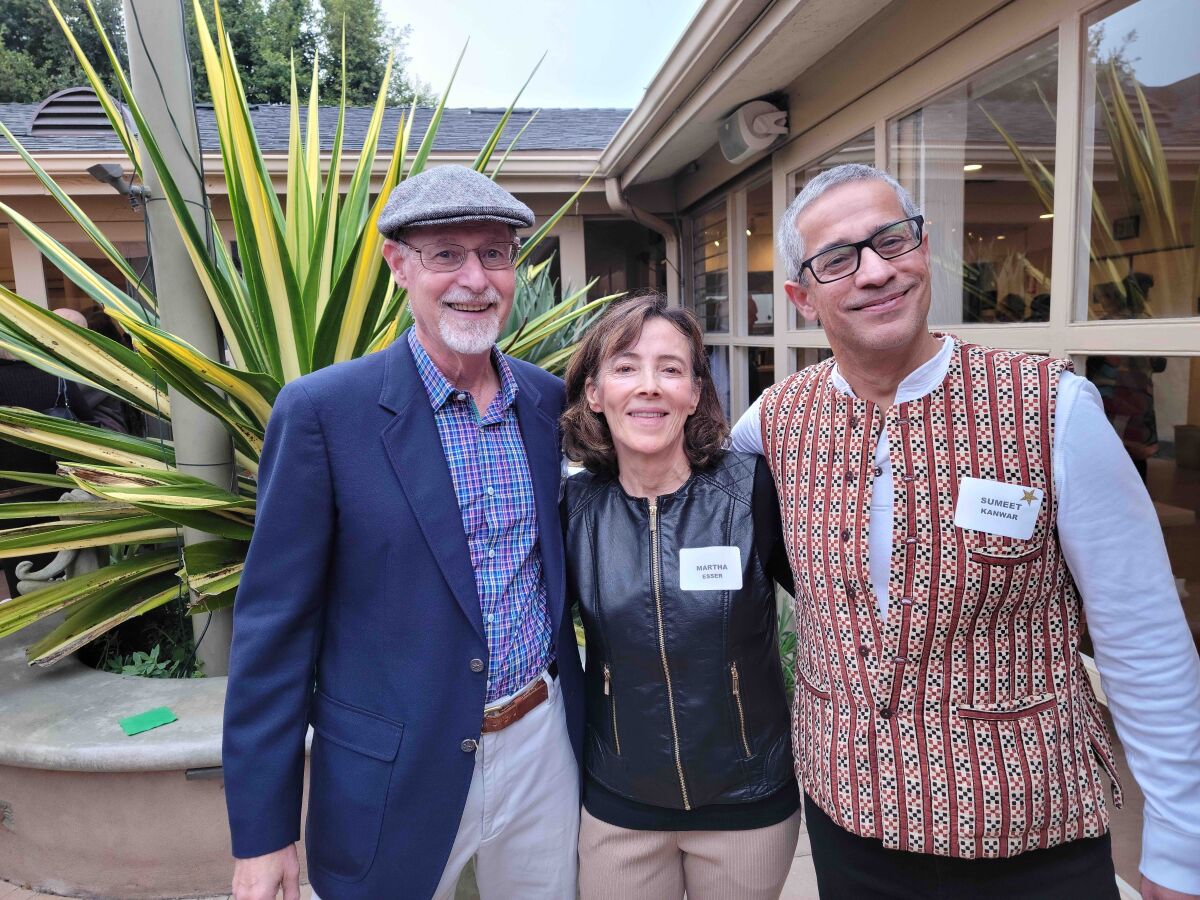 Alan Searleman, Martha Esser and Sumeet Kanwar attend a La Jolla Newcomers Club fall party at the La Jolla Community Center.
