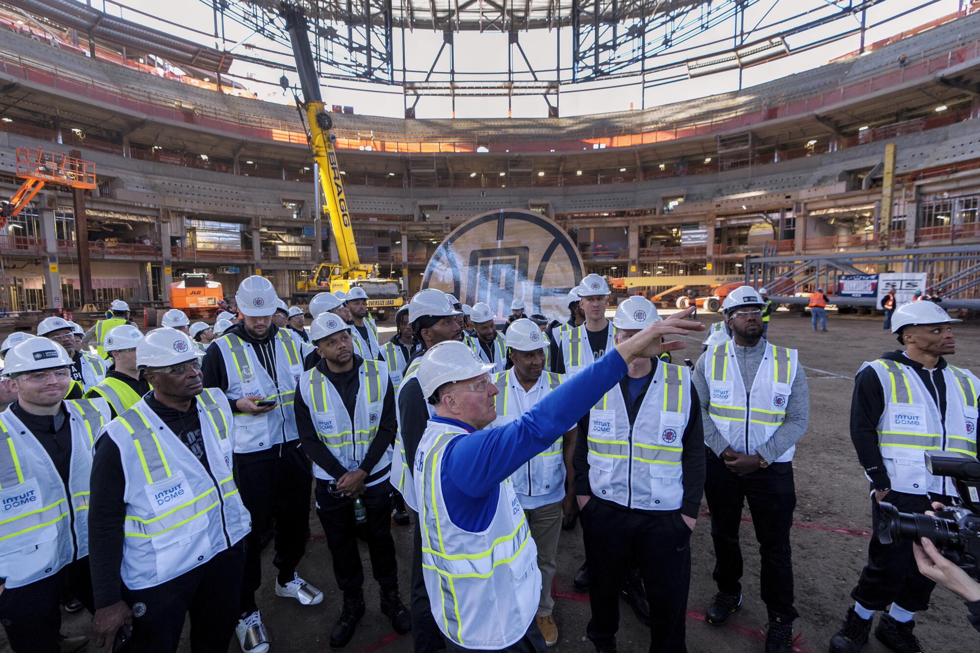 Los Angeles Clippers Chairman Steve Ballmer explains the seating area.