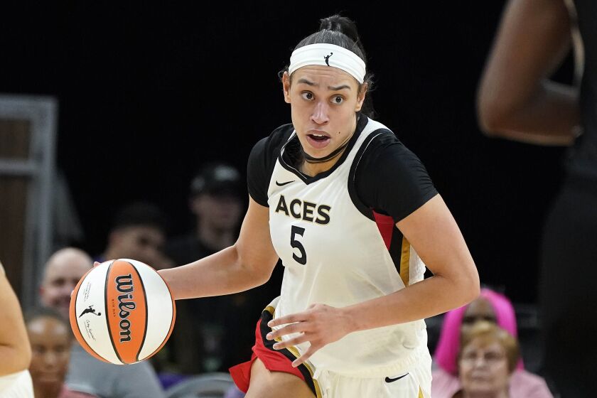 FILE - Las Vegas Aces' Dearica Hamby (5) dribbles up court during a WNBA basketball game against the Phoenix Mercury, on May 6, 2022, in Phoenix. Two-time WNBA All-Star Dearica Hamby was traded by the Las Vegas Aces to the Los Angeles Sparks on Saturday, Jan. 21, 2023. (AP Photo/Darryl Webb, File)