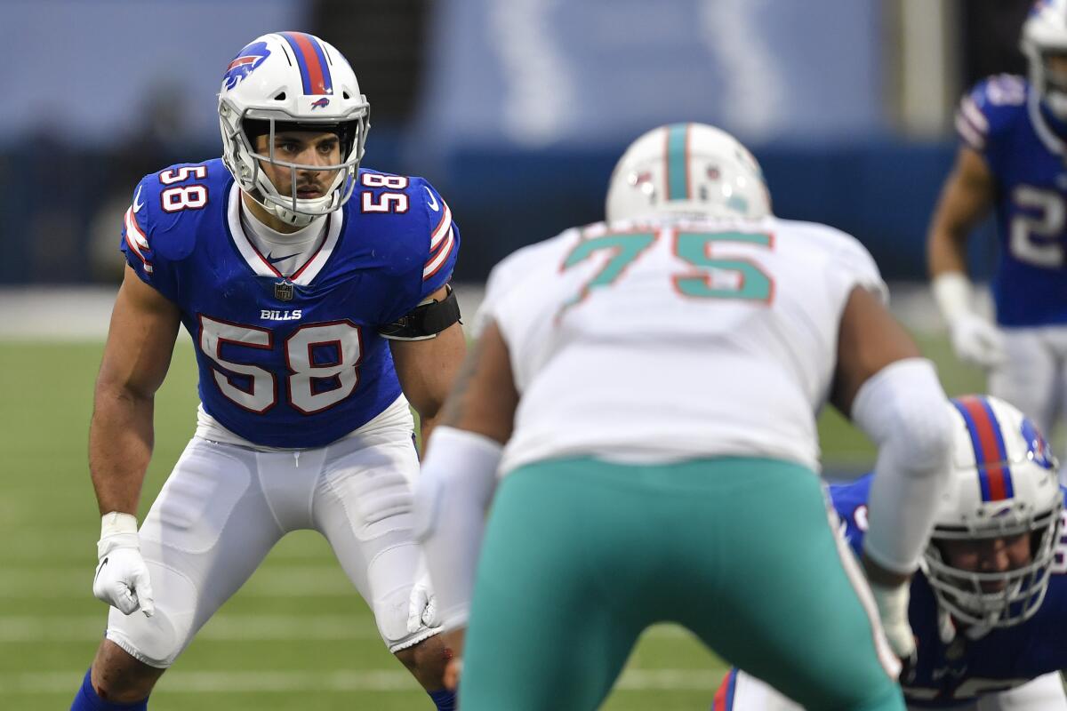 FILE - In this Sunday, Jan. 3, 2021 file photo, Buffalo Bills outside linebacker Matt Milano (58) sets up for a play in the second half of an NFL football game against the Miami Dolphins in Orchard Park, N.Y. The Buffalo Bills re-signed linebacker Matt Milano to a four-year contract on Thursday, March 11, 2021 less than a week before the three-year starter was eligible to become a free agent. The signing comes a day after the Bills freed up more than $14 million in space under the salary cap by releasing receiver John Brown and defensive lineman Quinton Jefferson.(AP Photo/Adrian Kraus, File)