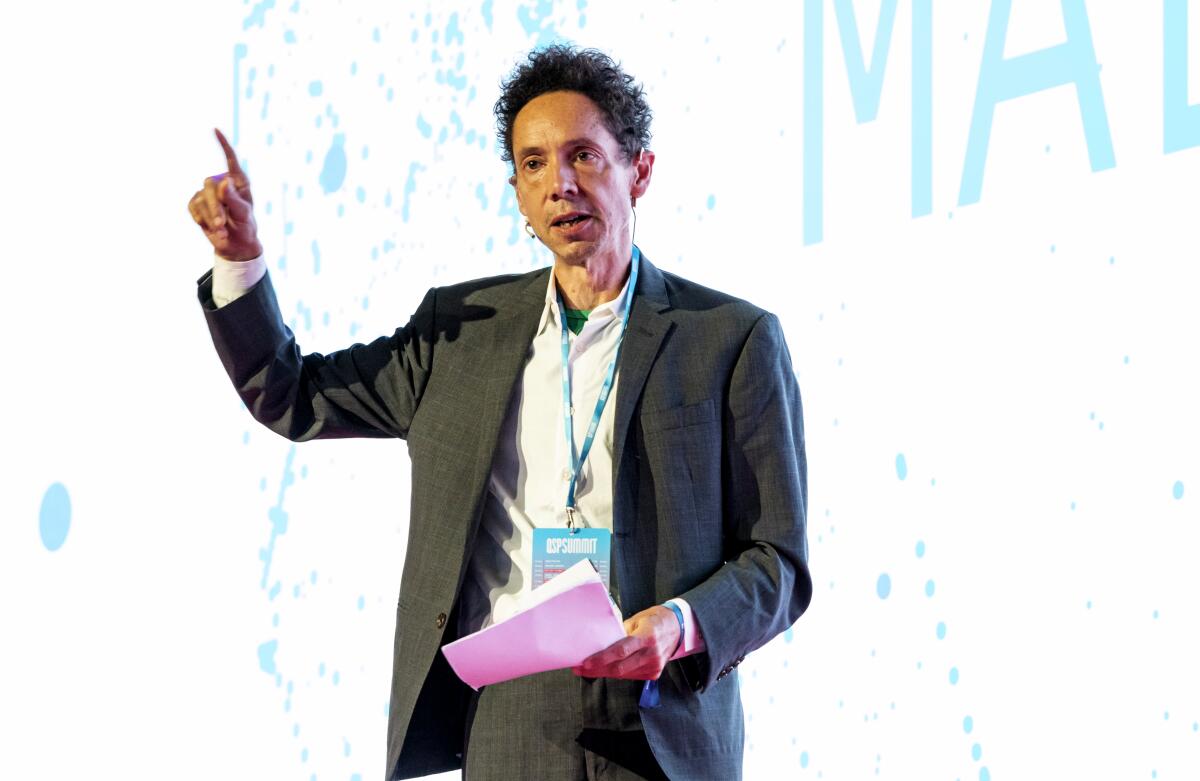 Writer Malcolm Gladwell raises a finger to make a point