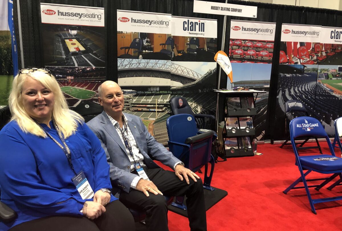 Brandy Masoian and Barry Pickell from Hussey Seating Company demonstrate the quality seating that come from a company which traces its origins to a business that began in 1835 by making and selling farm implements.