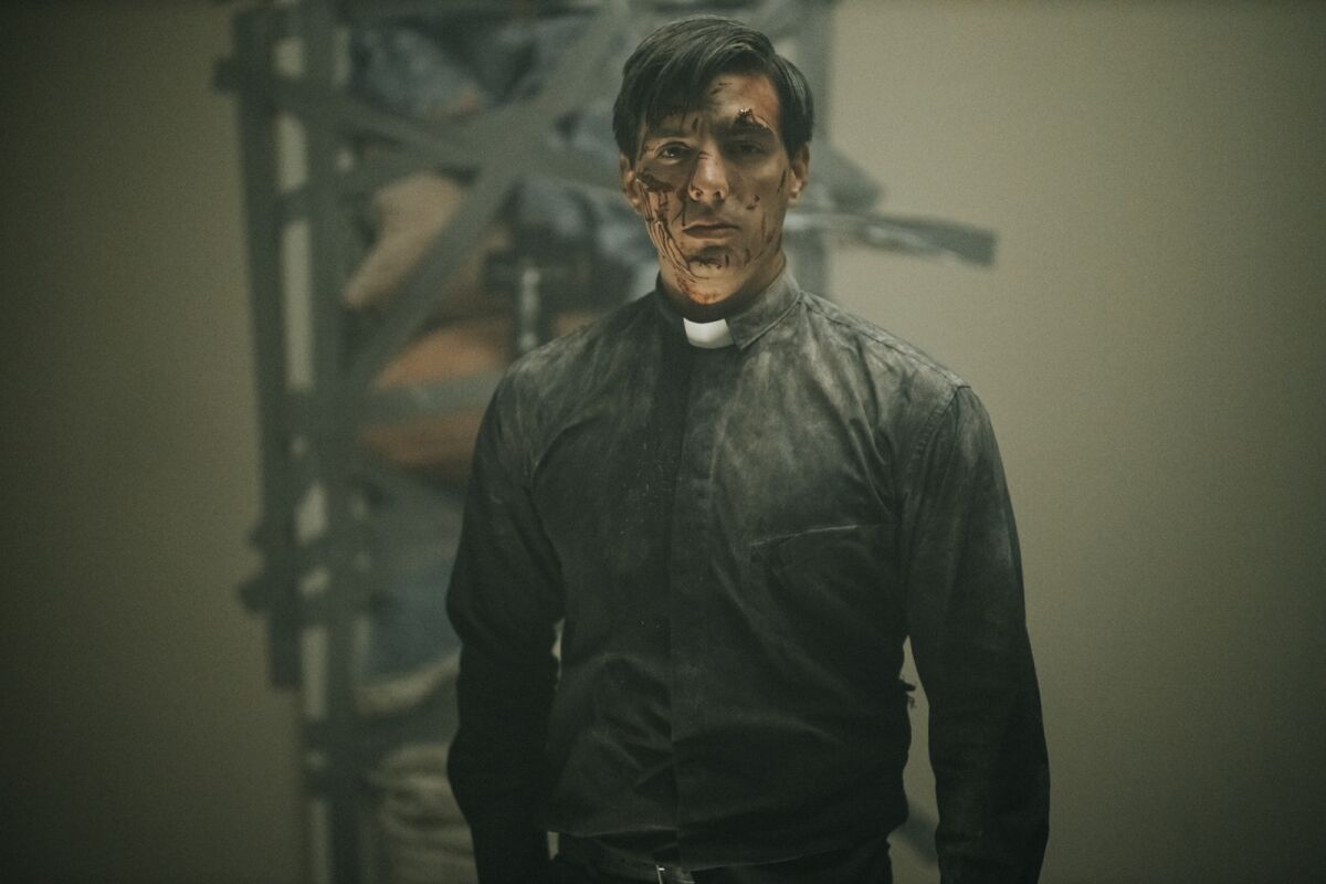 Vadhir Derbez as a beat-up priest in the movie "The Seventh Day."