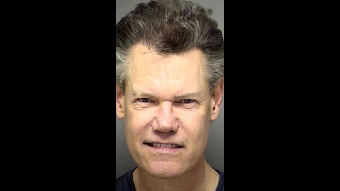 Randy Travis was arrested Feb. 6, 2012, on a charge of public intoxication. He was parked at a Baptist church, allegedly smelling of alcohol with an open bottle of wine in the front seat of his Trans Am.