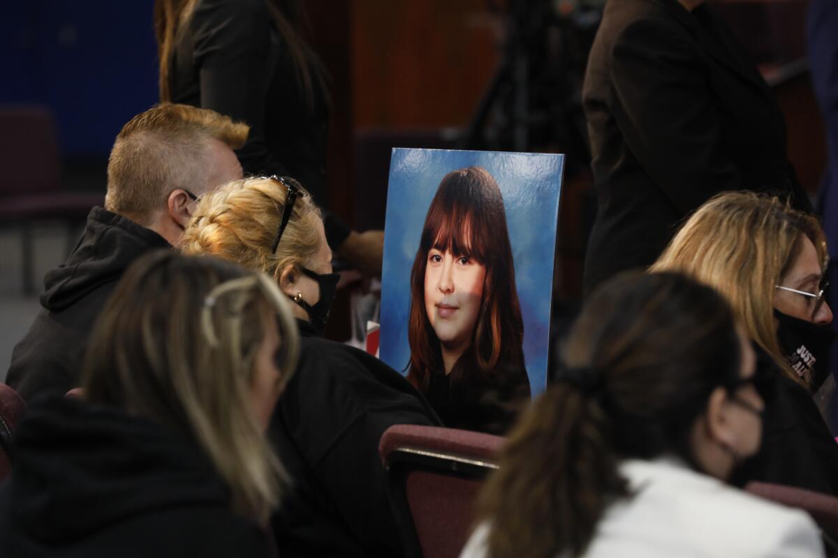 Soledad Peralta, the mother of Valentina Orellana Peralta, holds a photograph of her daughter.