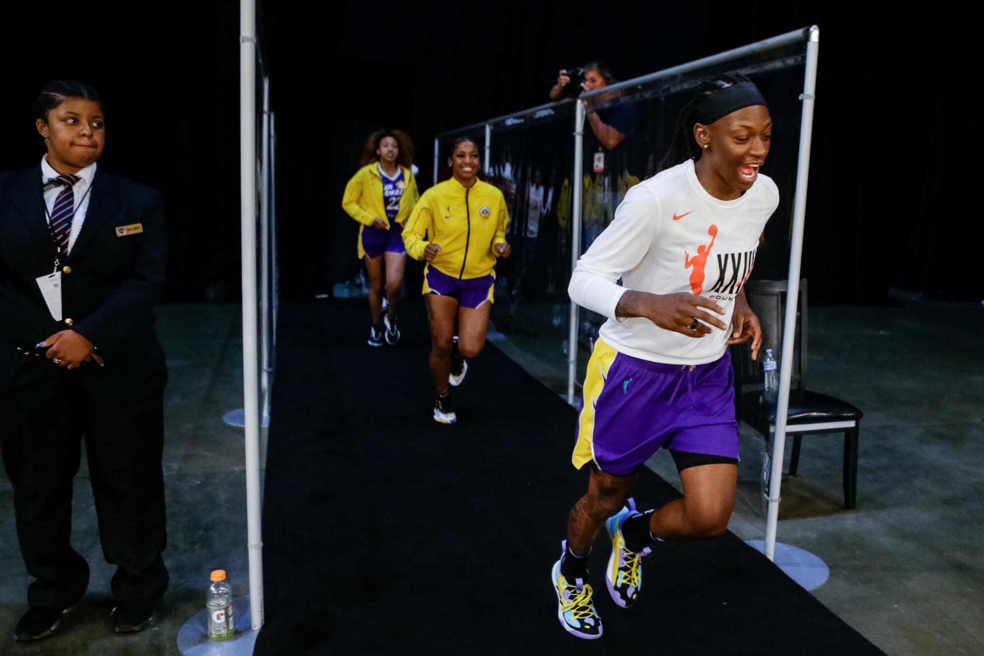 Sparks point guard Erica Wheeler runs out of the tunnel for shoot arounds before the game against the Las Vegas Aces.
