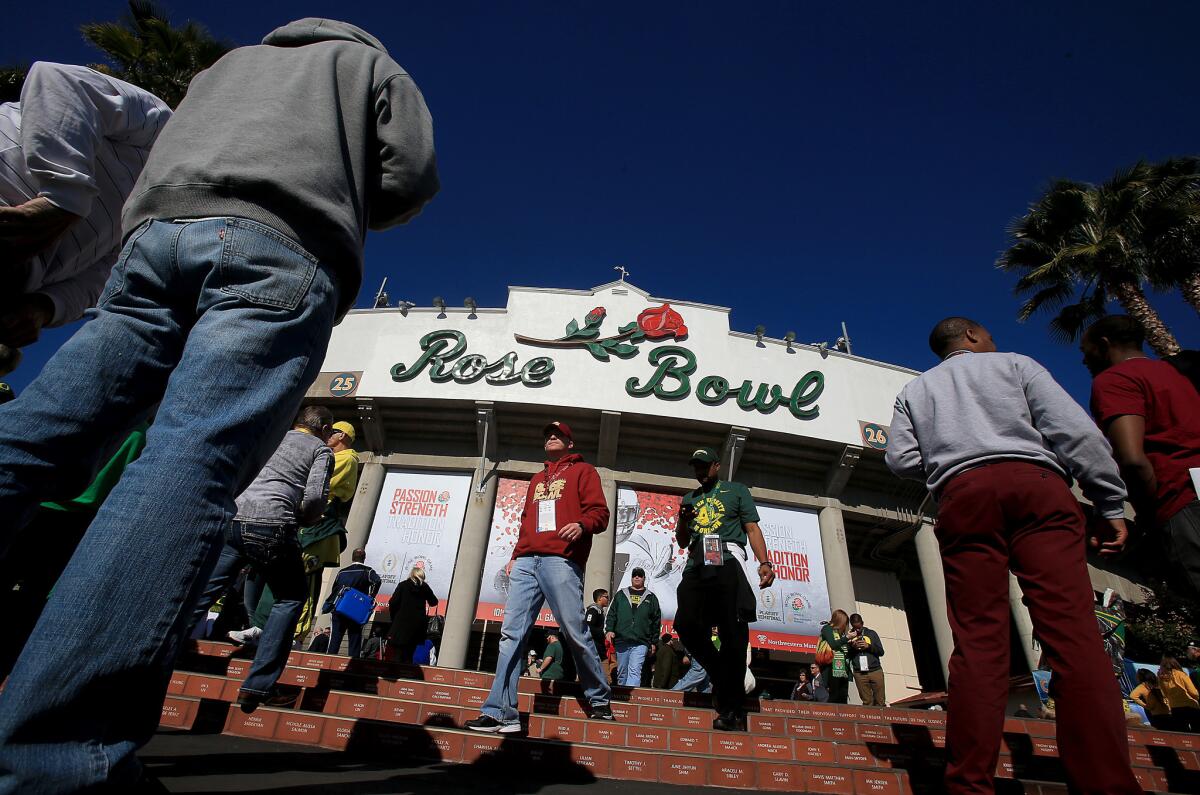 Fans arrive at the Rose Bowl in Pasadena.