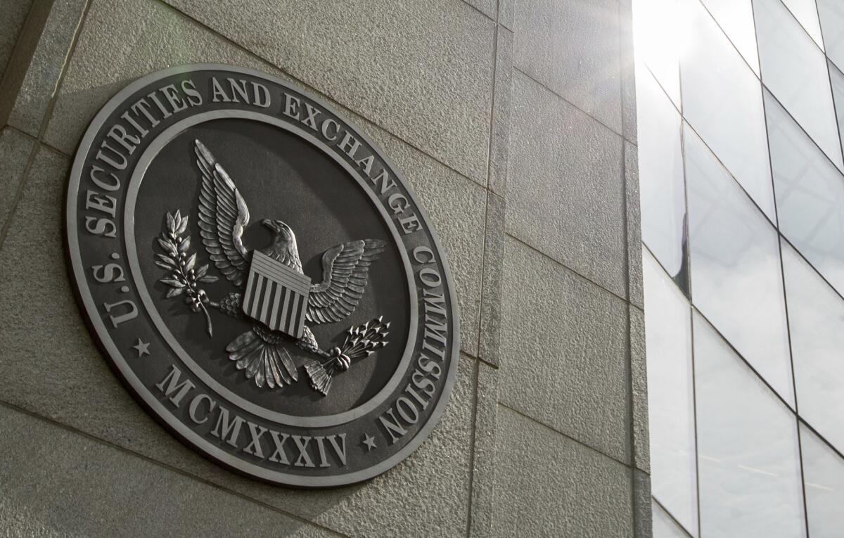 The seal of the U.S. Securities and Exchange Commission on the side of a building