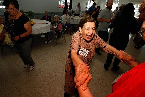 Adriana Trevino, 93, who has Alzheimer's disease, participates in a dance session at the El Rinconcito del Sol Adult Day Care Center in Boyle Heights. Gov. Arnold Schwarzenegger is proposing to shut down the states adult day healthcare centers, which provide services to help the elderly continue living at home. Also eliminated would be a program that funds Alzheimers care at these and other centers.