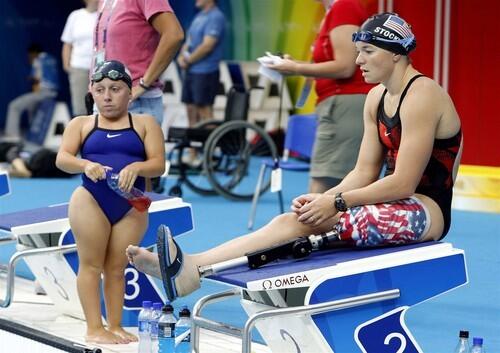 United States swimmers Melissa Stockwell, right, and Casey Johnson