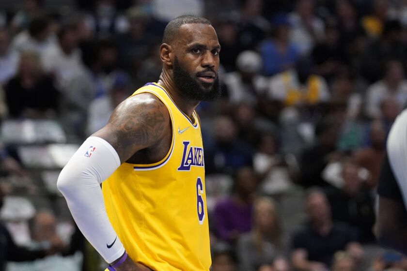 Los Angeles Lakers forward LeBron James watches referee James Williams.