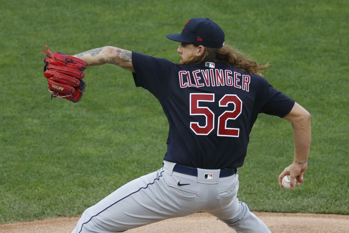 Cleveland Indians pitcher Mike Clevinger throws against the Minnesota Twins in the first inning of a baseball game Friday, July 31, 2020, in Minneapolis. (AP Photo/Jim Mone)