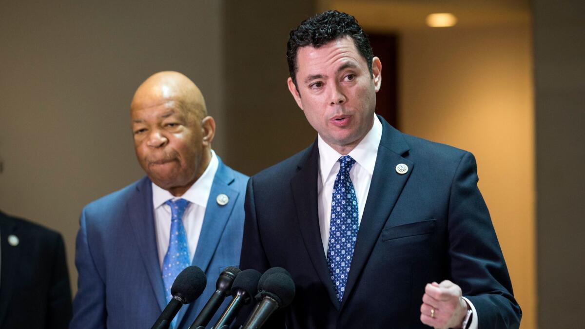 Republican Congressman Jason Chaffetz (R) and Democratic Congressman Elijah Cummings (L), announce that President Trump's former National Security Advisor Michael Flynn did not disclose payments from Russia for a 2015 speech, in Washington on April 25.