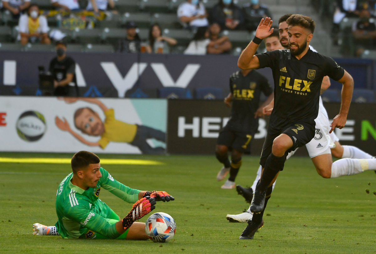 Galaxy goalie Jonathan Bond stops a shot by LAFC's Diego Rossi in the first half May 8, 2021.