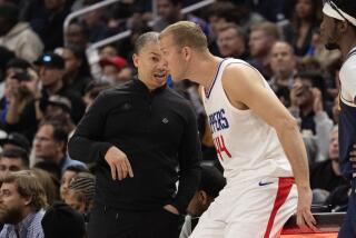LOS ANGELES, CA - APRIL 4, 2024: Clippers head coach Tyronn Lue chats with LA Clippers.