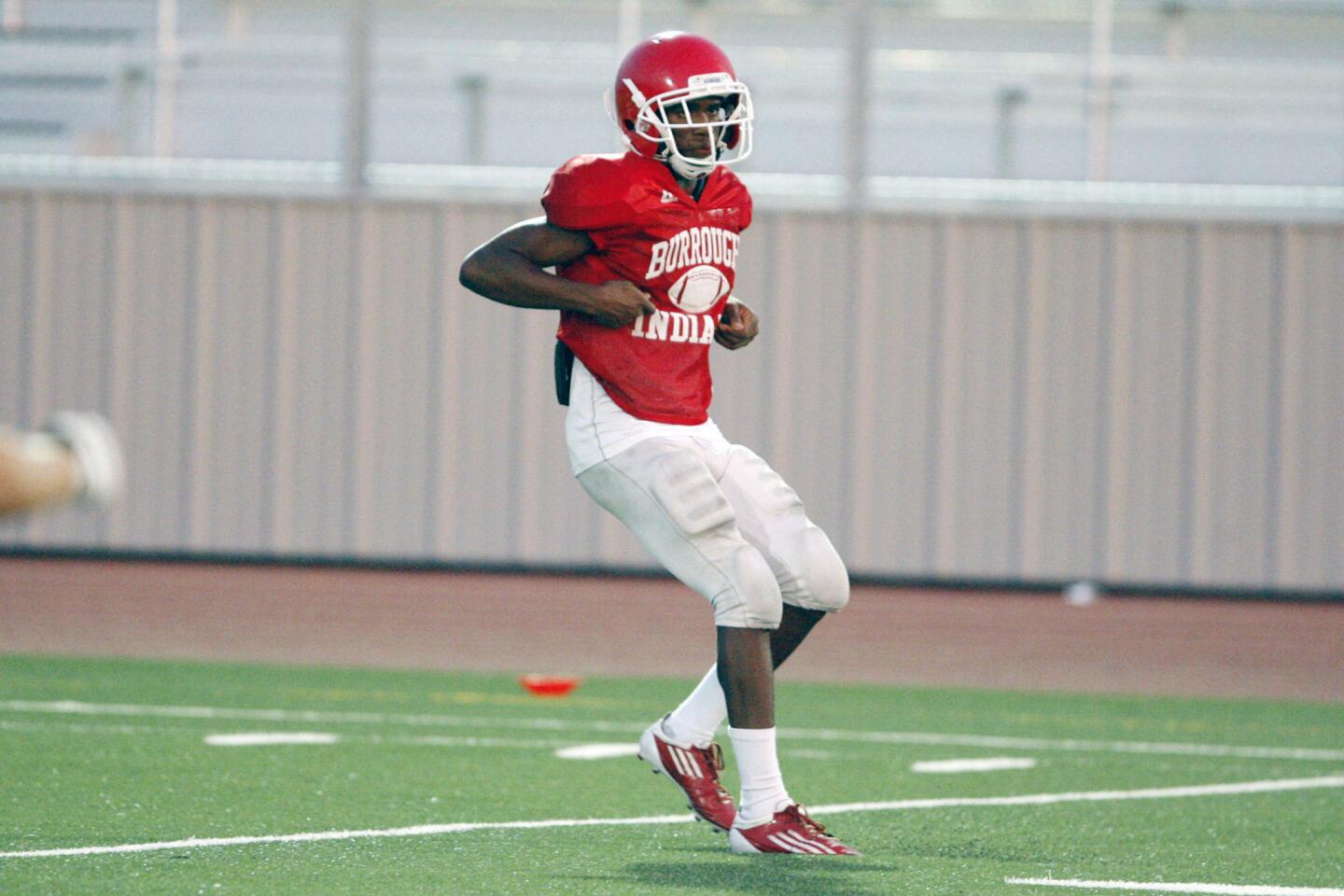Burroughs' Oharjee Brown runs through a play during practice at John Burroughs High School in Burbank on Wedesday, August 15, 2012.