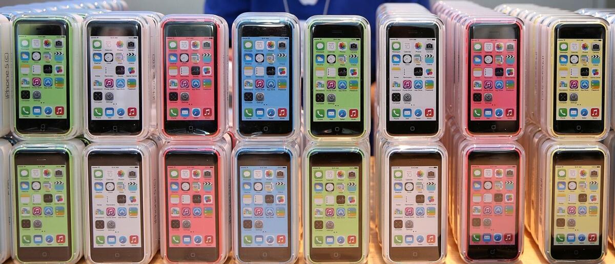 Rows of the iPhone 5c are displayed at an Apple store in 2013.