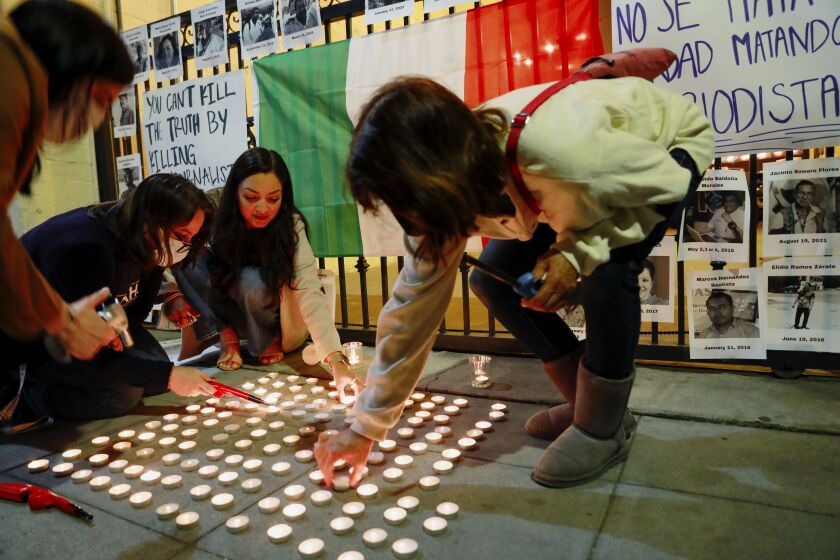 People gather to honor slain Tijuana journalists Margarito Martinez Esquivel and Lourdes Maldonado.