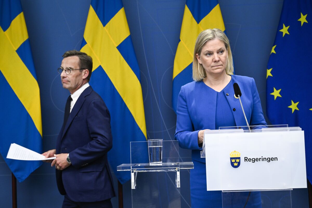 Sweden's Prime Minister Magdalena Andersson, right, and the Moderate Party's leader Ulf Kristersson give a news conference in Stockholm, Sweden, Monday, May 16, 2022. Sweden's government has decided to apply for a NATO membership. (Henrik Montgomery/TT News Agency via AP)