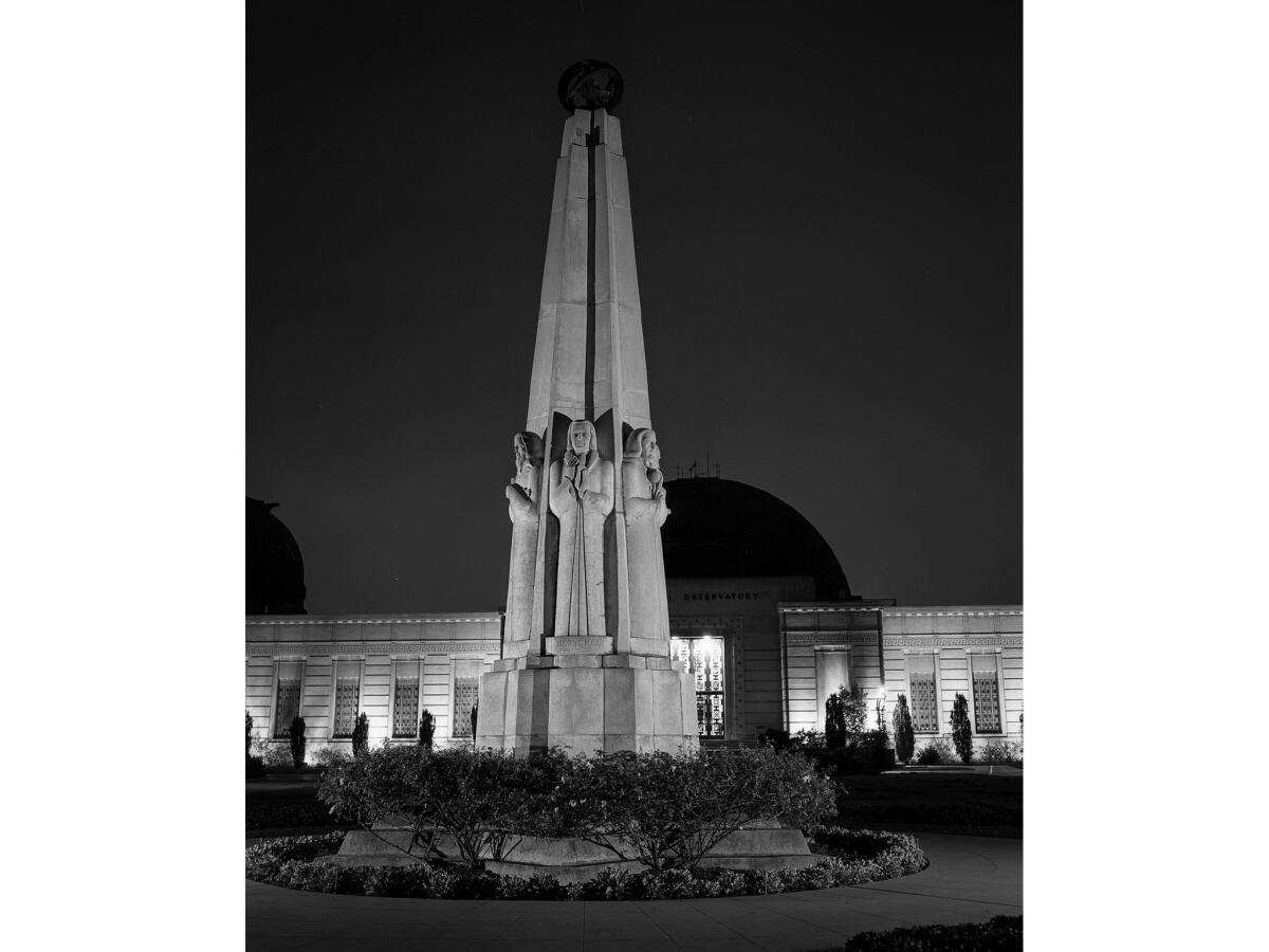 Nov. 18, 1955: The Astronomers Monument sits right outside the entrance to Los Angeles' Griffith Observatory.