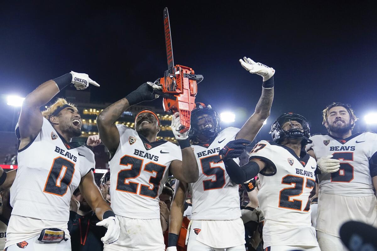 Oregon State defensive back Ryan Cooper Jr. (23) and teammates celebrate in the sideline after he intercepted a pass during the second half of an NCAA college football game against Stanford in Stanford, Calif., Saturday, Oct. 8, 2022. Oregon State won 28-27. (AP Photo/Godofredo A. Vásquez)