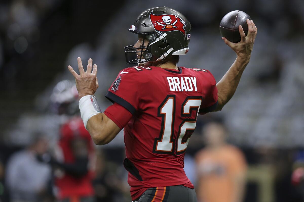 Tampa Bay Buccaneers quarterback Tom Brady warms up before a loss to the New Orleans Saints on Oct. 31.