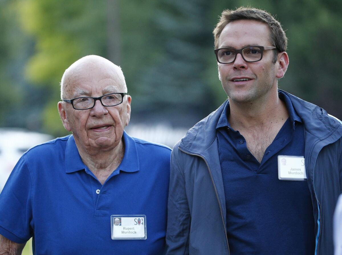 Rupert Murdoch's Fox on Friday announced that it would sell its interest in pay TV systems in Germany and Italy to British Sky Broadcasting in a $9.3 billion deal. The move generates more than $7 billion in after-tax cash that Fox could use in its bid for Time Warner. Pictured: CEO of 21st Century Fox Rupert Murdoch (L) and his son James, co-chief operating officer of Fox, arrive for the Allen and Company 32nd Annual Media and Technology Conference, in Sun Valley, Idaho, in July 2014.