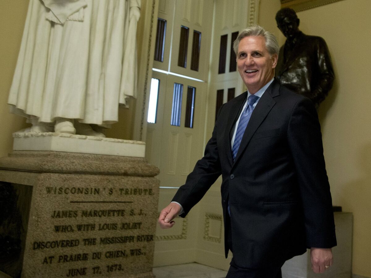 House Majority Leader Kevin McCarthy of California walks toward the House Chamber on Capitol Hill.